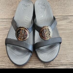 CROCS Women's Gray Slide Sandals with Gold Medallion Accent